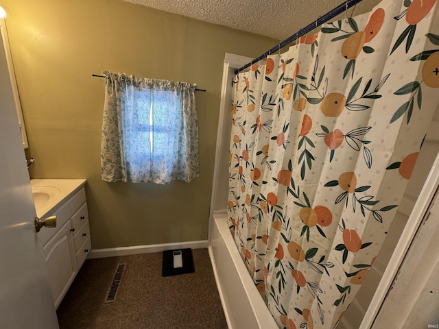 bathroom featuring shower / bath combo, visible vents, baseboards, a textured ceiling, and vanity