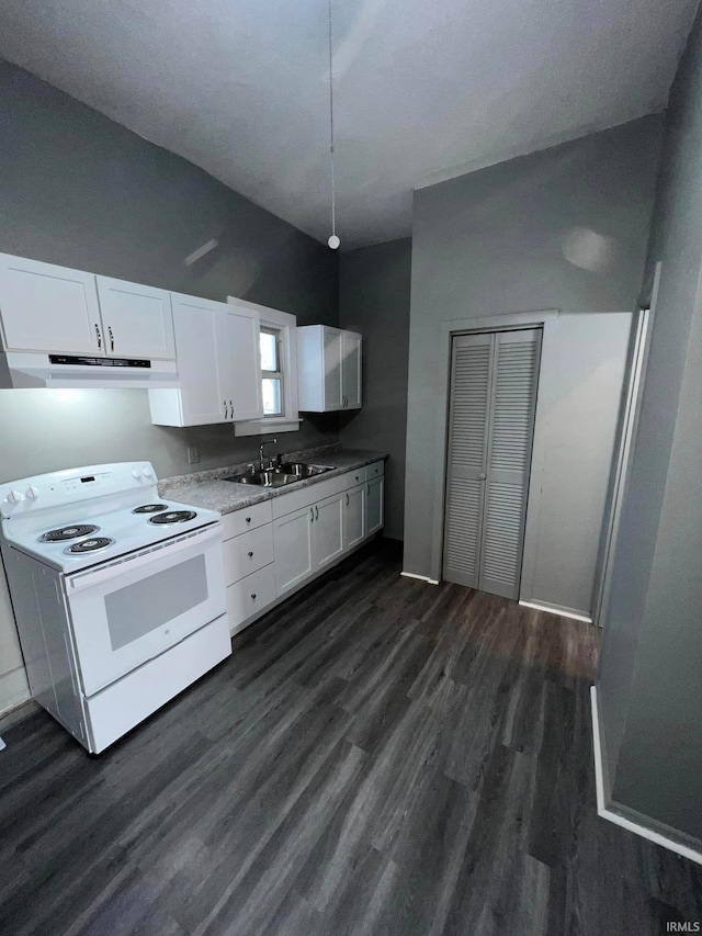 kitchen featuring white cabinets, a sink, under cabinet range hood, and white range with electric cooktop