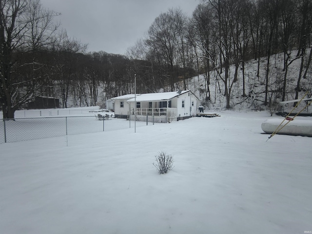 view of front of home featuring fence