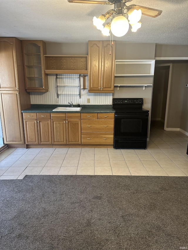 906 Varner Ave, Evansville, IN 47720 - kitchen featuring dark countertops, open shelves, black electric range, and light tile patterned floors