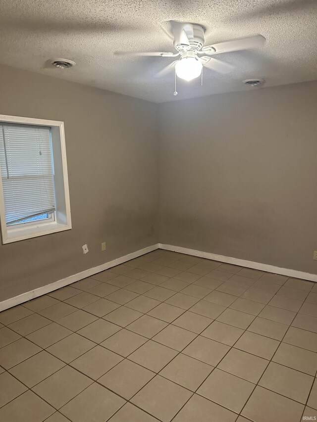 906 Varner Ave, Evansville, IN 47720 - spare room with a textured ceiling, baseboards, ceiling fan, and visible vents