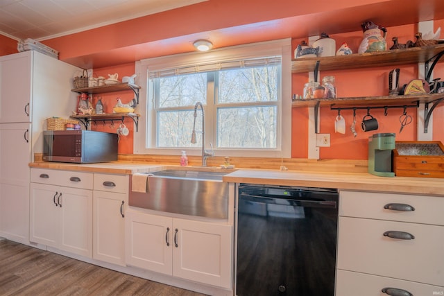 kitchen with black dishwasher, wood counters, stainless steel microwave, and open shelves