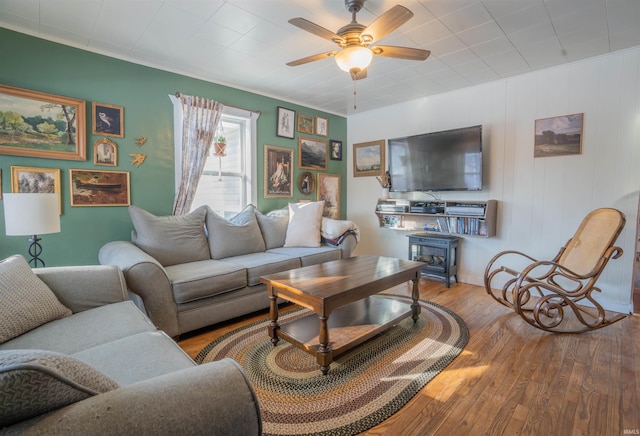 living area featuring ceiling fan and wood finished floors