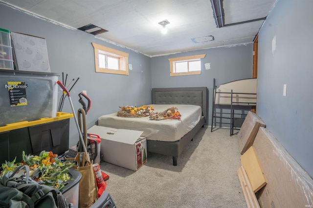 bedroom featuring light carpet and visible vents