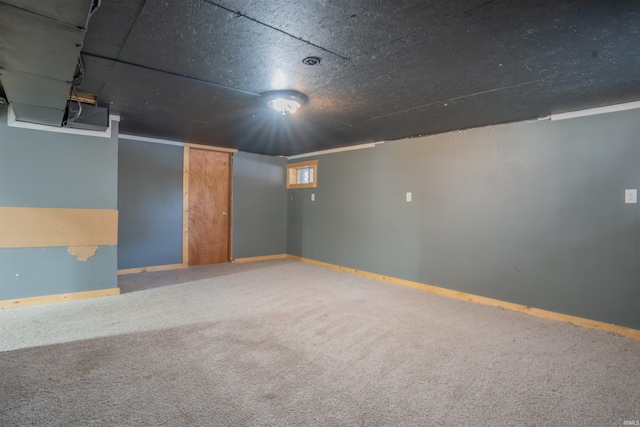 basement featuring carpet and baseboards