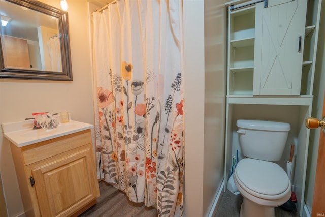 full bathroom featuring curtained shower, vanity, toilet, and wood finished floors