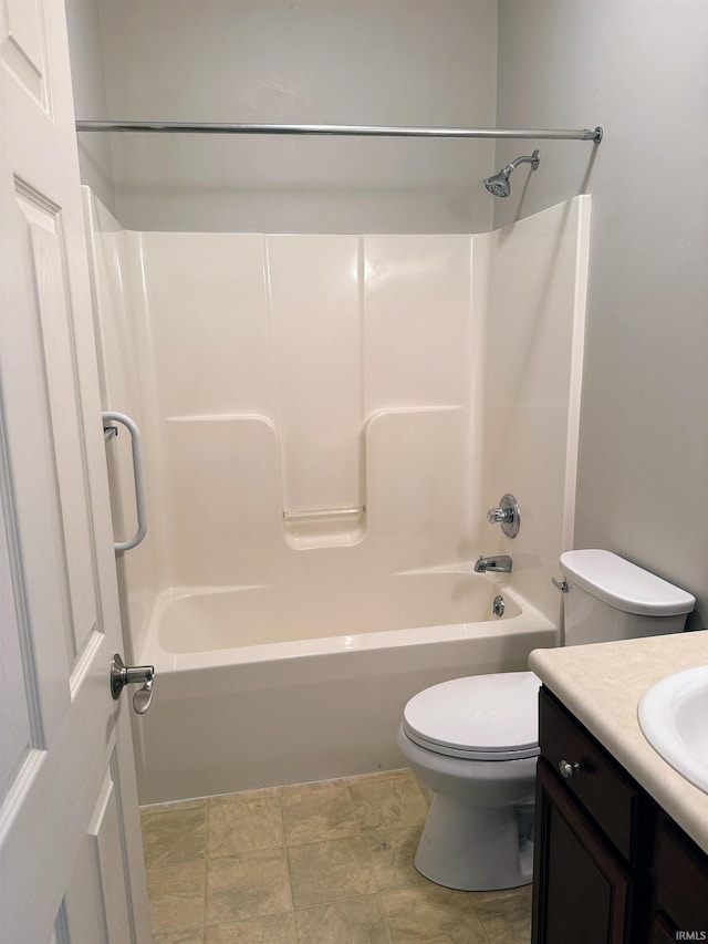 bathroom with shower / bath combination, vanity, and toilet