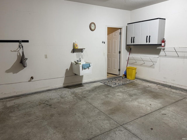 garage featuring baseboards