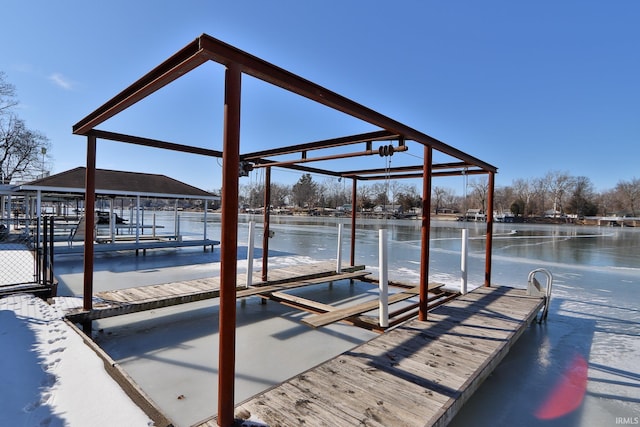 view of dock with a water view and boat lift