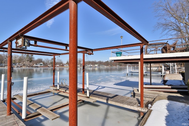 dock area with a water view and boat lift