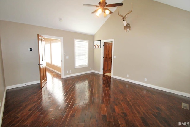 unfurnished room featuring visible vents, baseboards, a ceiling fan, dark wood-type flooring, and high vaulted ceiling