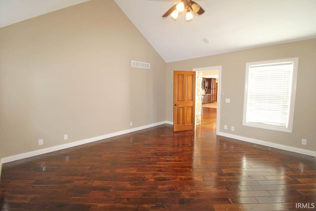 unfurnished room with dark wood-style flooring, visible vents, ceiling fan, and baseboards