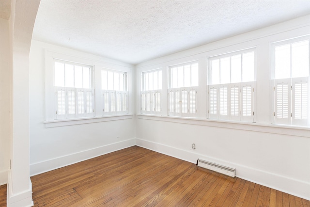 unfurnished sunroom featuring visible vents