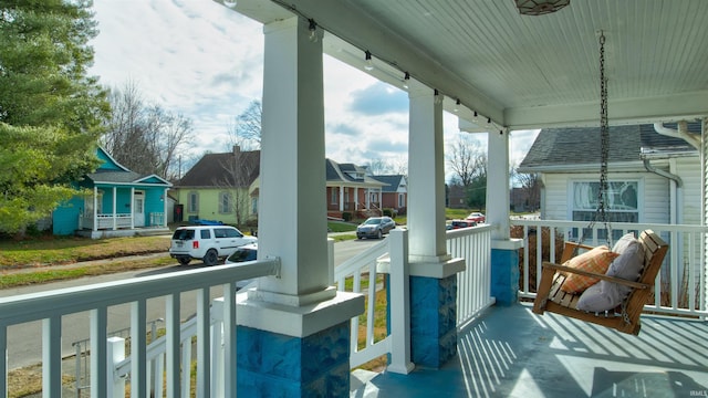 balcony with a residential view and a porch