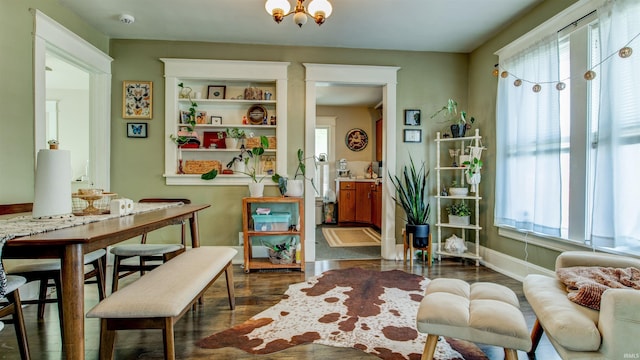 sitting room featuring dark wood finished floors and baseboards