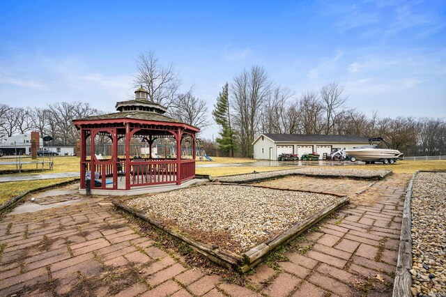 exterior space with playground community and a gazebo