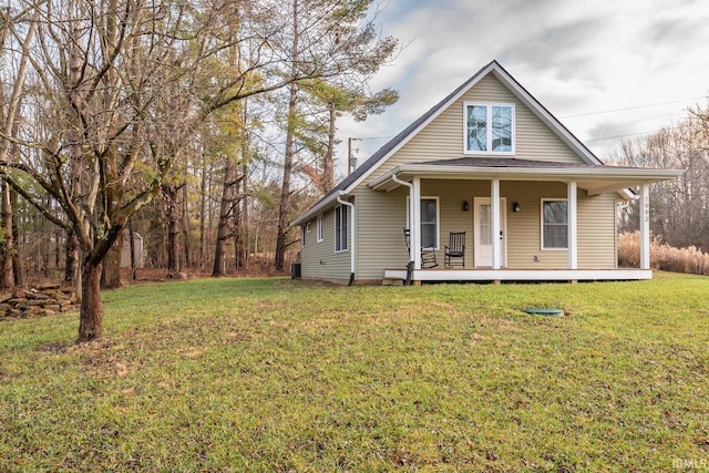 view of front of property with covered porch and a front lawn