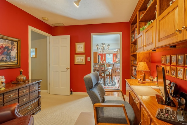 home office with light carpet, baseboards, and a chandelier