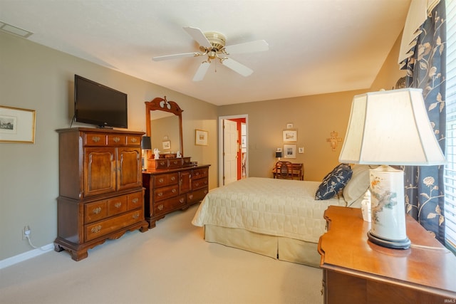 bedroom featuring light carpet, ceiling fan, and visible vents