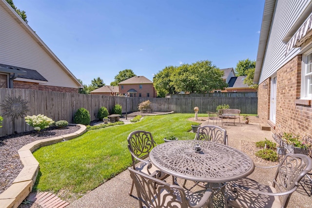 view of yard with a fenced backyard and a patio