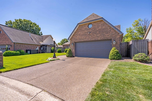 view of front of property featuring brick siding, driveway, a front lawn, and fence