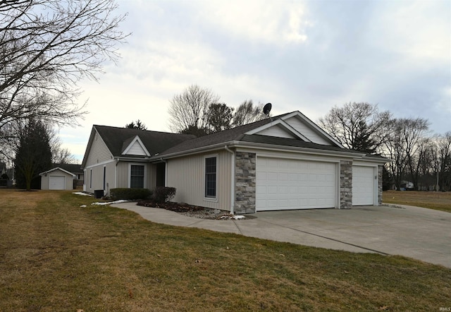 view of home's exterior with stone siding, a lawn, an attached garage, and driveway