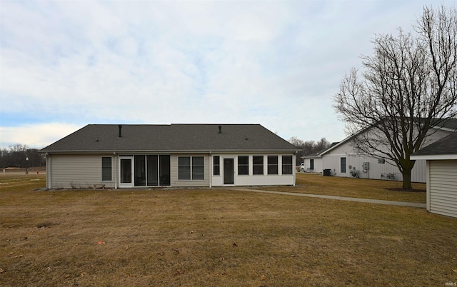 back of house featuring a yard