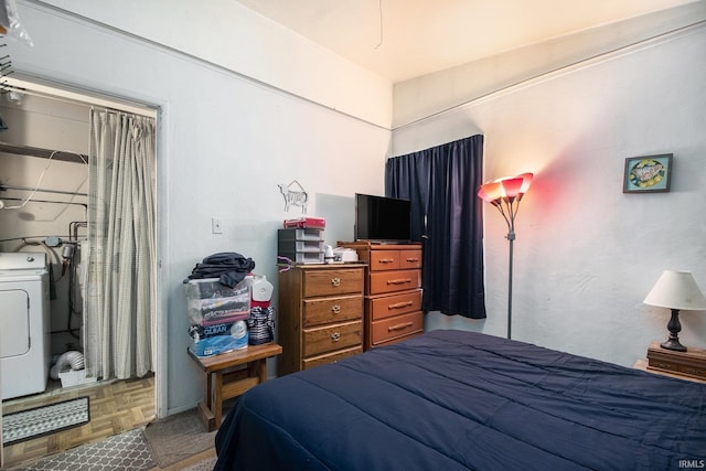 bedroom featuring washer / dryer