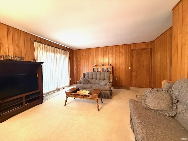 living room with light carpet and wood walls