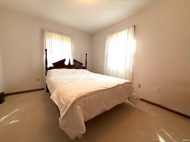 bedroom with carpet and baseboards