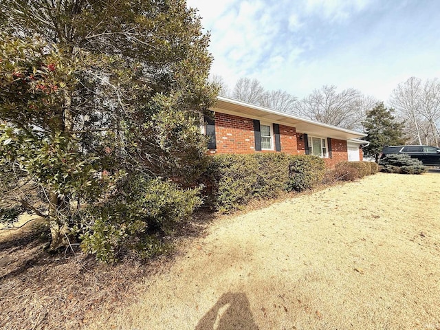 view of home's exterior featuring brick siding