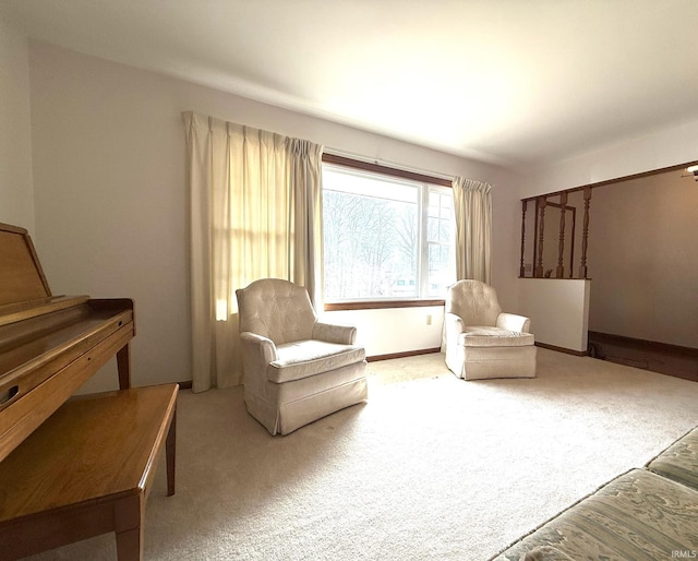 living area with carpet floors and baseboards