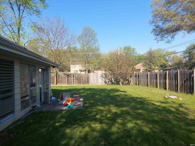 view of yard with a fenced backyard