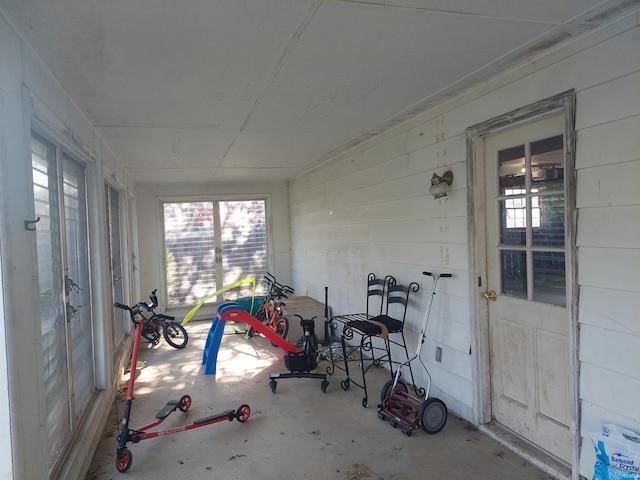 unfurnished sunroom with plenty of natural light