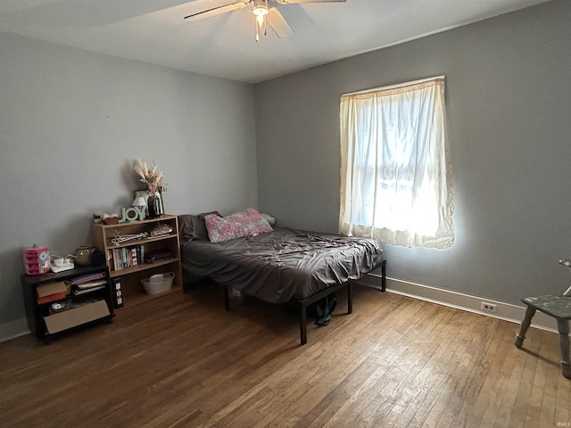 bedroom featuring ceiling fan, baseboards, and hardwood / wood-style floors