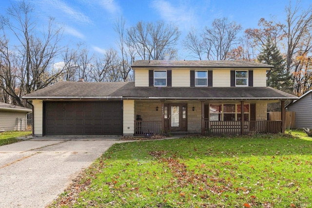 view of front facade with a porch, concrete driveway, a front yard, a garage, and stone siding