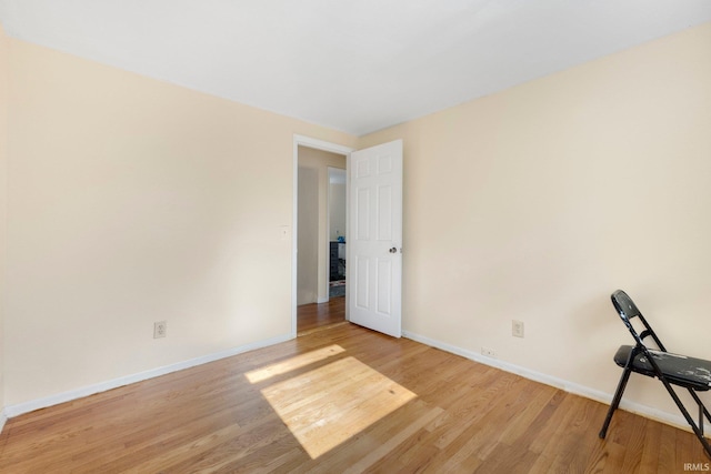 interior space with light wood-type flooring and baseboards