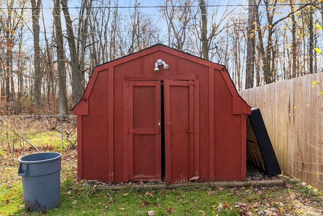 view of shed with fence