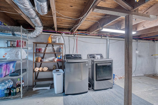 interior space with laundry area and washer and clothes dryer