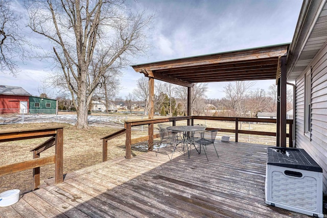 wooden deck featuring outdoor dining space