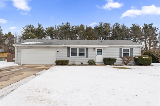 ranch-style home with entry steps, driveway, and a garage