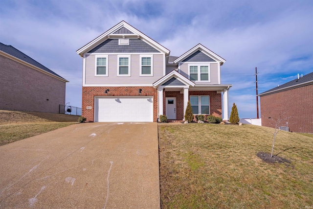 craftsman-style house with a front yard, concrete driveway, and brick siding