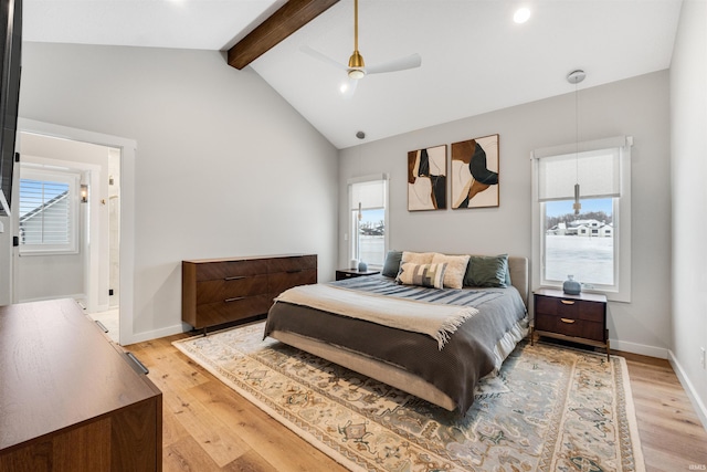 bedroom featuring lofted ceiling with beams, ceiling fan, light wood finished floors, and baseboards