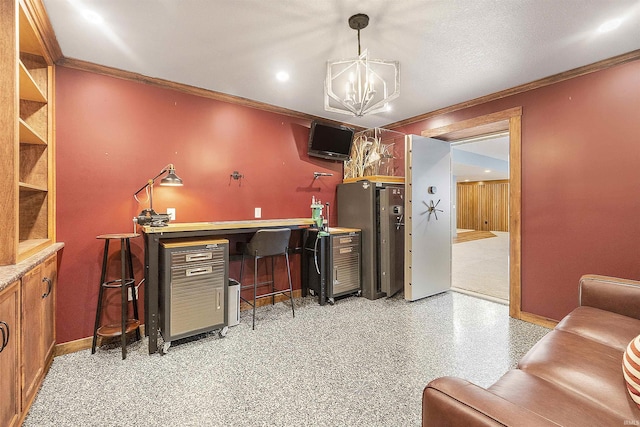 office area featuring baseboards, ornamental molding, and a chandelier