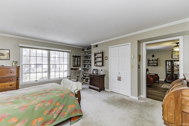 bedroom with light carpet, ornamental molding, visible vents, and baseboards