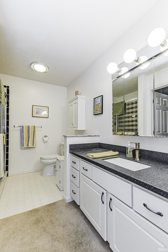 bathroom with a shower with shower curtain, toilet, vanity, a textured ceiling, and baseboards