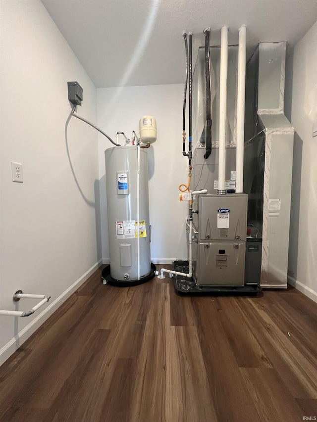 utility room featuring water heater and heating unit