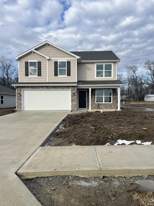 view of front of home featuring driveway, an attached garage, and roof with shingles