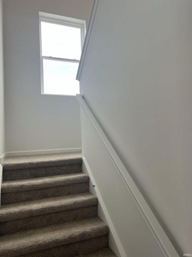 stairway with baseboards