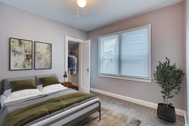 carpeted bedroom with baseboards